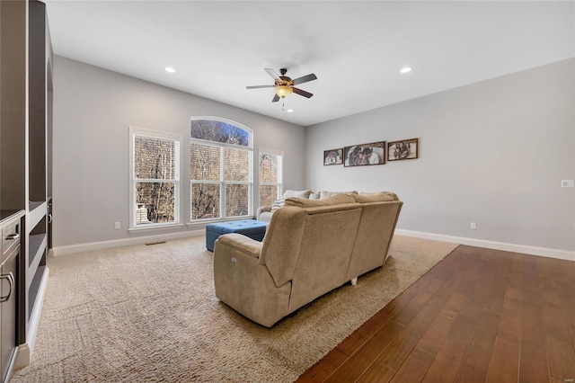 living room with recessed lighting, baseboards, wood finished floors, and a ceiling fan