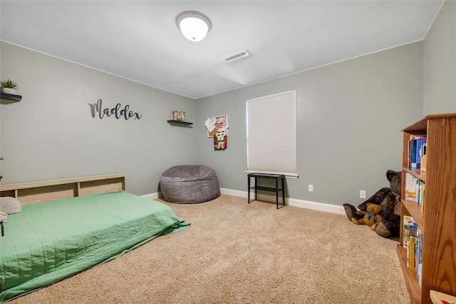 bedroom featuring baseboards, visible vents, and carpet floors