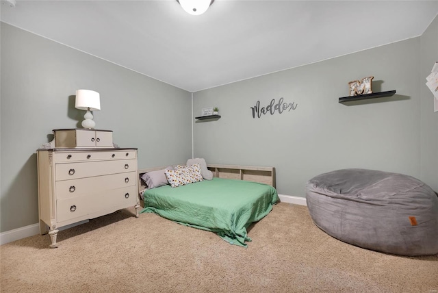 carpeted bedroom with baseboards