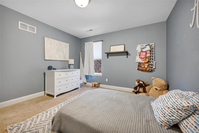 bedroom with visible vents, baseboards, and carpet