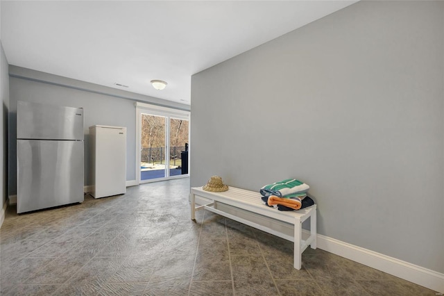 hallway featuring baseboards