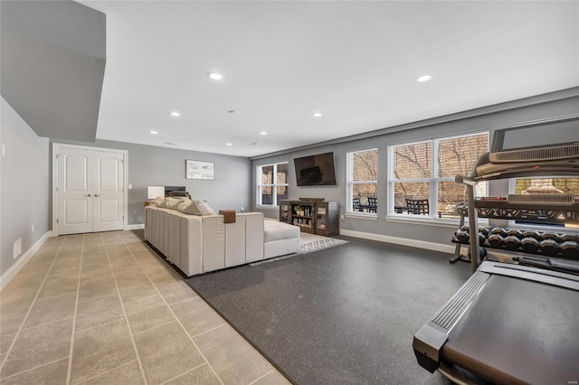 living area featuring recessed lighting and baseboards