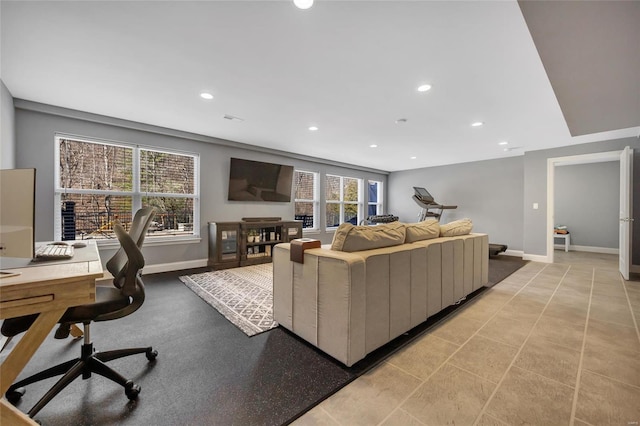 living room with recessed lighting and baseboards