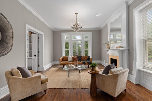 living room featuring baseboards, a fireplace, dark wood finished floors, and crown molding