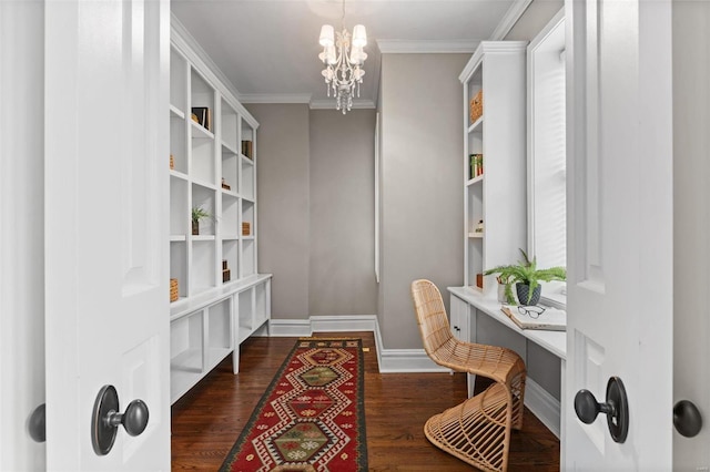 office area with baseboards, dark wood-style flooring, built in study area, and crown molding