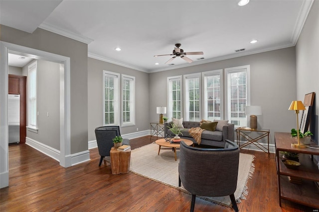 living room featuring recessed lighting, baseboards, wood finished floors, and ornamental molding