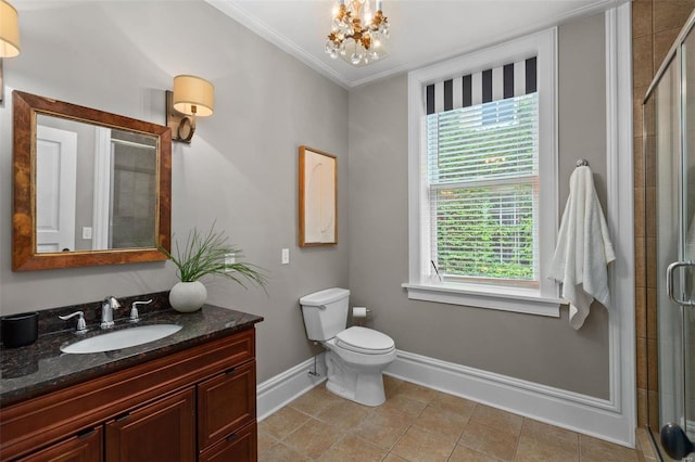 full bath with a stall shower, tile patterned flooring, baseboards, and vanity