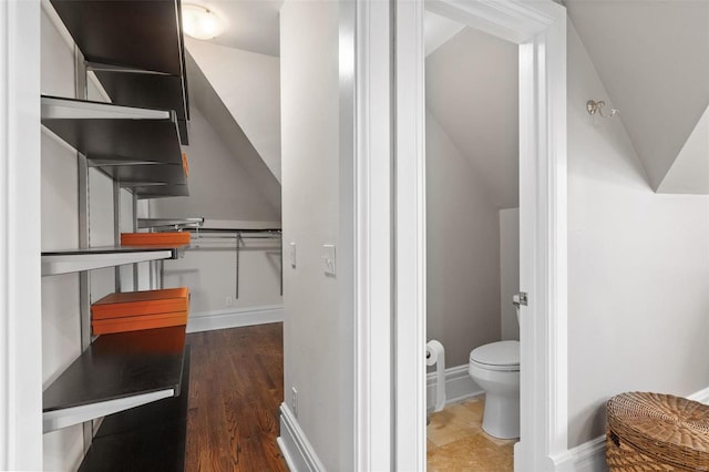 bathroom featuring toilet and baseboards