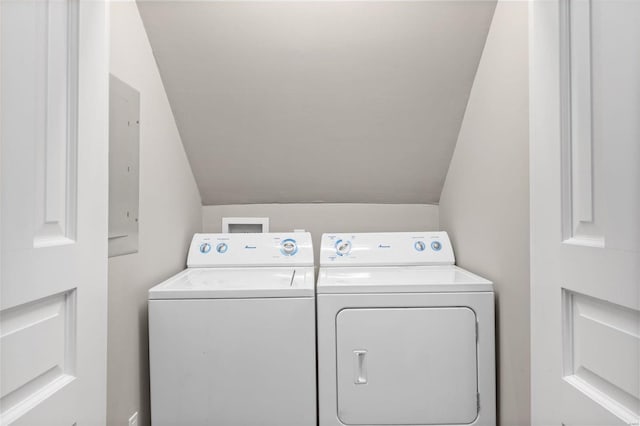 clothes washing area featuring washer and clothes dryer