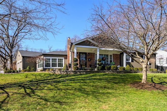 view of front of home featuring a front lawn, brick siding, a garage, and a chimney