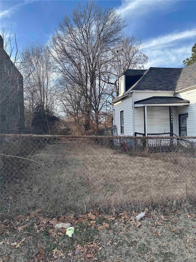 view of home's exterior featuring fence