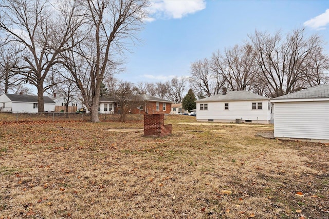 view of yard featuring fence and a residential view