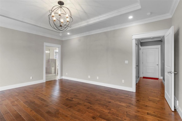 unfurnished room with baseboards, a raised ceiling, ornamental molding, dark wood-style flooring, and an inviting chandelier