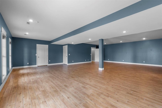 unfurnished living room with recessed lighting, visible vents, light wood-style flooring, and baseboards