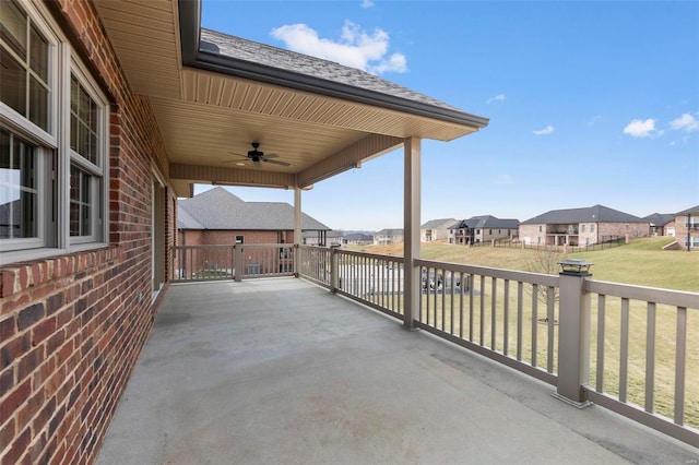 view of patio featuring ceiling fan and a residential view