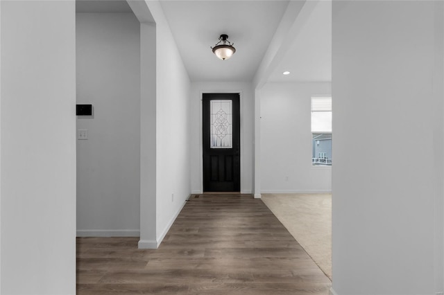 entryway featuring recessed lighting, wood finished floors, and baseboards