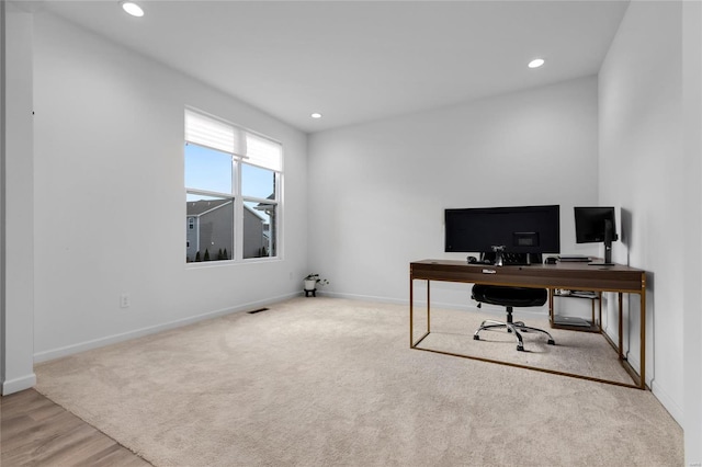 office space with recessed lighting, carpet, and baseboards