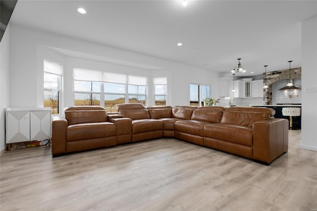 living area featuring recessed lighting and light wood-style flooring