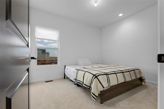 bedroom with recessed lighting, visible vents, baseboards, and light colored carpet