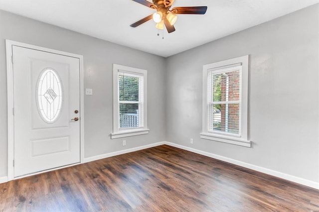 foyer entrance featuring a ceiling fan, plenty of natural light, baseboards, and wood finished floors