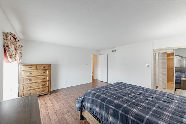 bedroom with wood finished floors