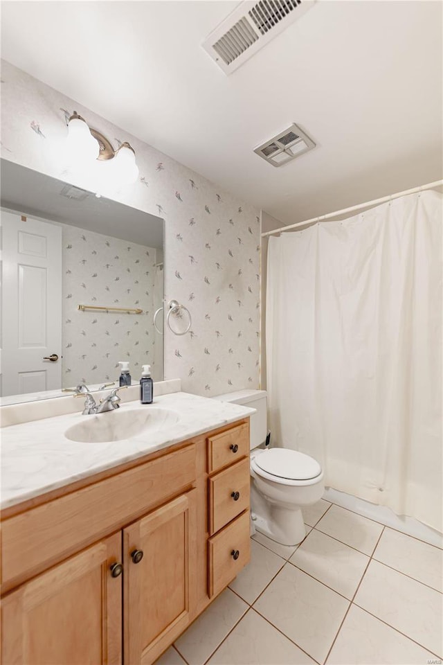 bathroom featuring tile patterned floors, visible vents, and wallpapered walls