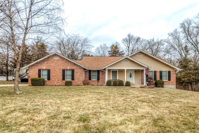 ranch-style house with brick siding and a front lawn