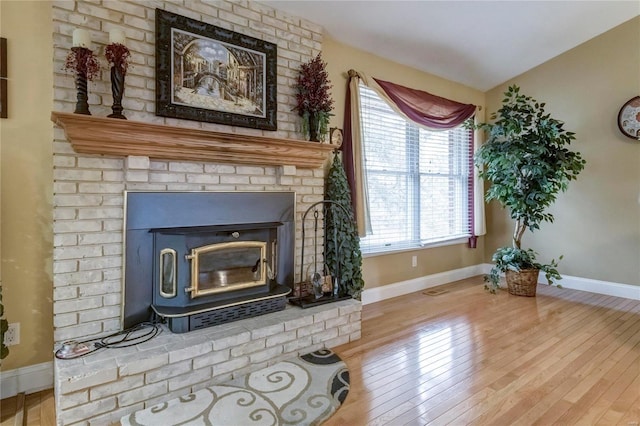 living area featuring hardwood / wood-style floors and baseboards