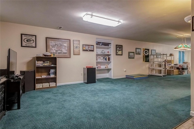 misc room with visible vents, carpet floors, and baseboards