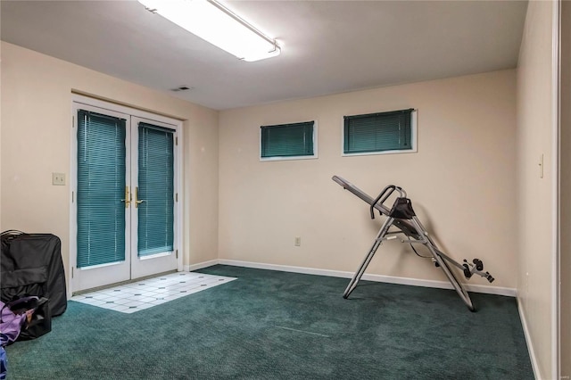 exercise area featuring french doors, baseboards, and carpet