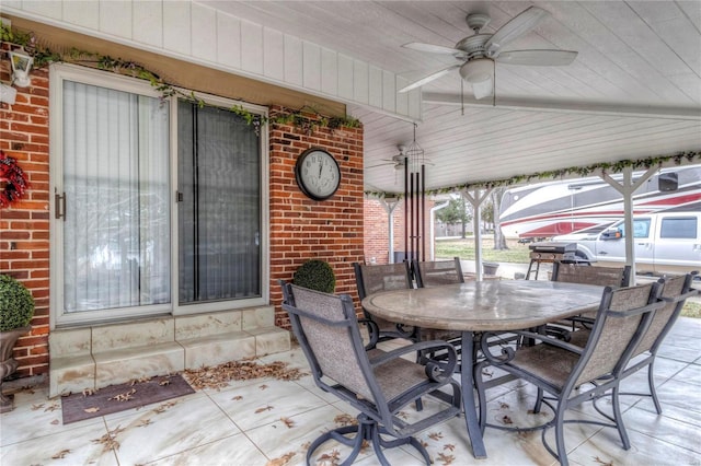 view of patio / terrace featuring outdoor dining area and a ceiling fan