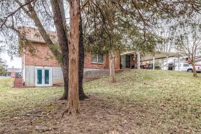 view of yard featuring french doors