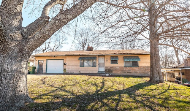 ranch-style home with an attached garage, a chimney, and a front lawn