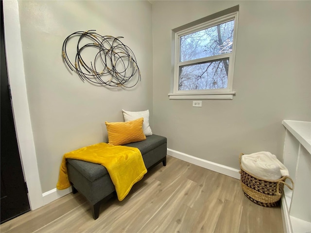 sitting room with light wood-style flooring and baseboards