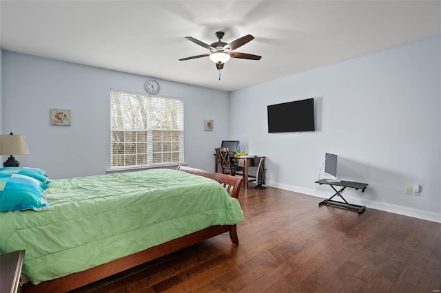 bedroom featuring dark wood-type flooring, baseboards, and a ceiling fan