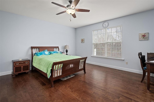 bedroom featuring visible vents, ceiling fan, hardwood / wood-style flooring, and baseboards