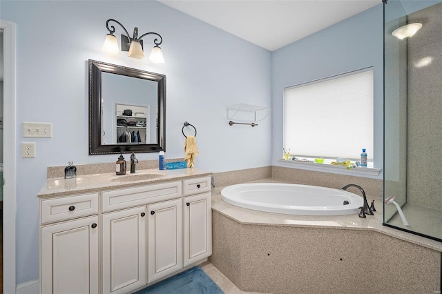 full bathroom with a bath and vanity