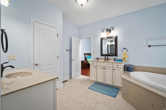 bathroom with two vanities, a sink, and tile patterned flooring