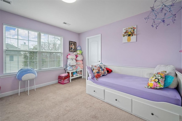 bedroom with baseboards, visible vents, and carpet flooring