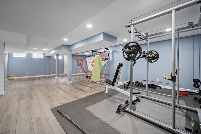 exercise area with recessed lighting, baseboards, and wood finished floors