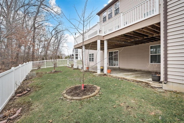 view of yard with a patio, a fenced backyard, and a wooden deck