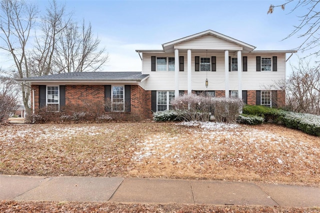 neoclassical / greek revival house with brick siding