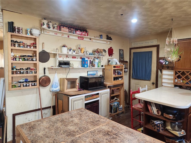 kitchen featuring open shelves and light countertops