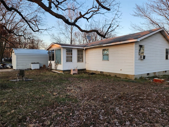 back of property featuring crawl space