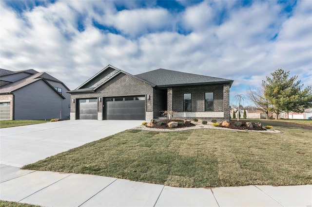 view of front of property featuring a garage, brick siding, driveway, roof with shingles, and a front yard