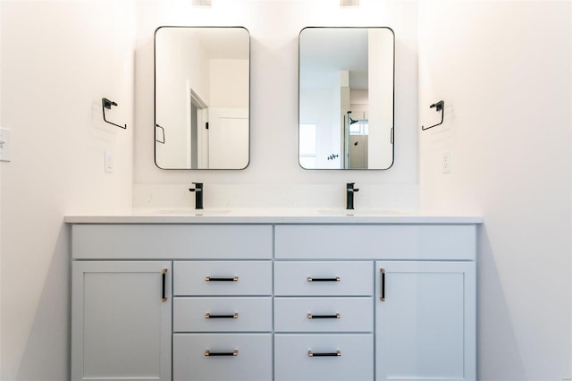 bathroom with double vanity and a sink