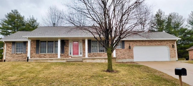 ranch-style house with a garage, driveway, brick siding, and a front yard