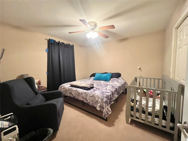 carpeted bedroom featuring a ceiling fan