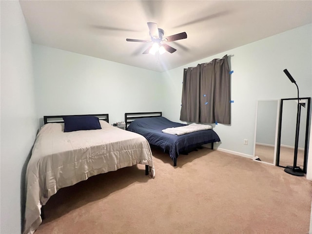 bedroom featuring ceiling fan, carpet flooring, and baseboards