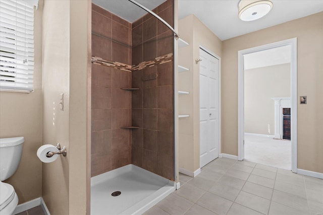 full bath featuring a brick fireplace, baseboards, toilet, tiled shower, and tile patterned floors